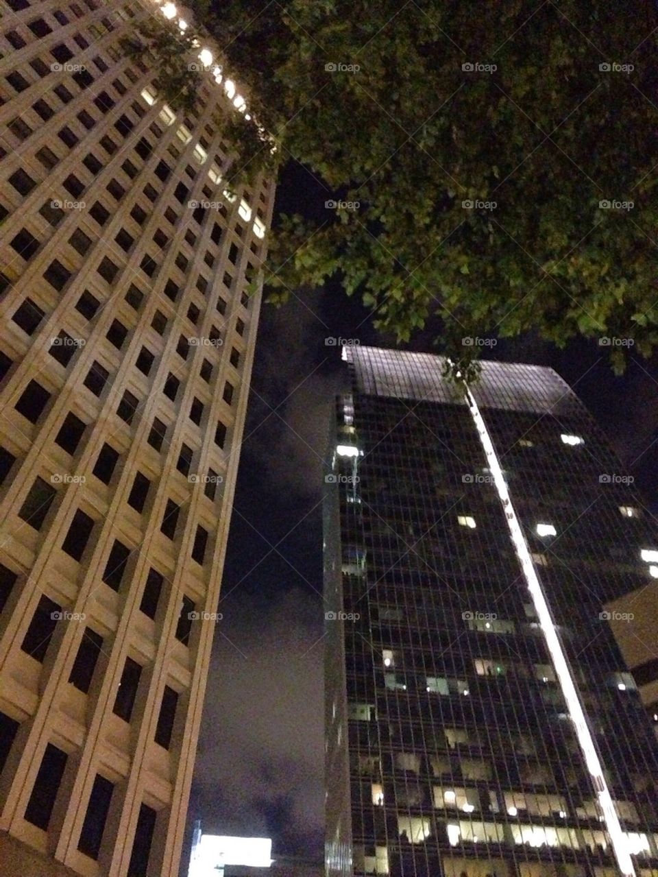 Sky scrapers at colony Square on a cloudy night in Midtown Atlanta Georgia