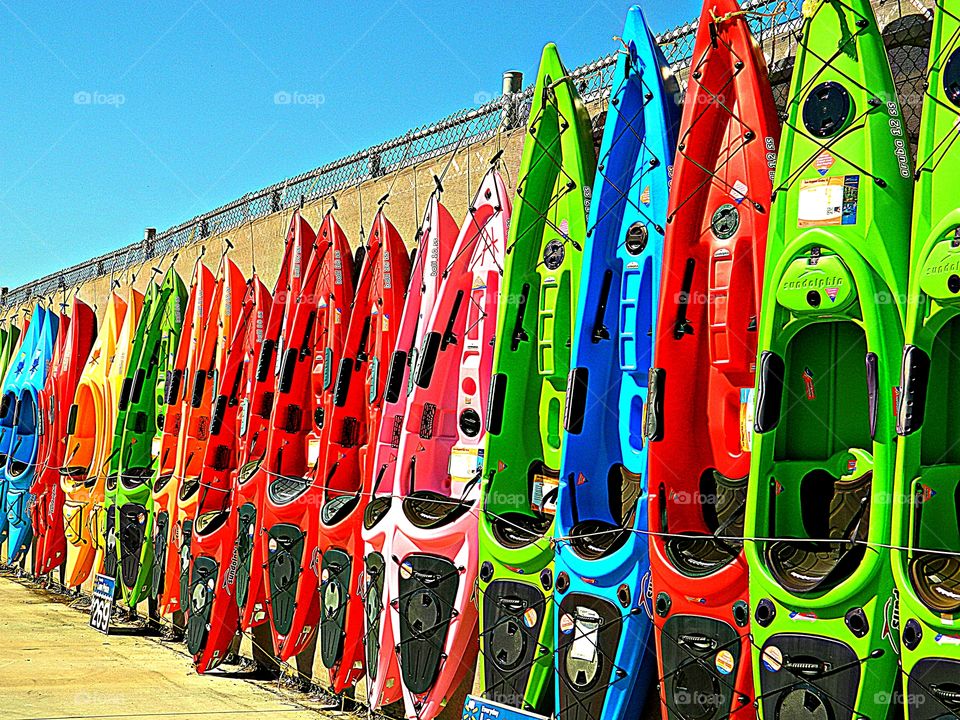 Clash of colors - Contrasting colored kayaks standing next to each other