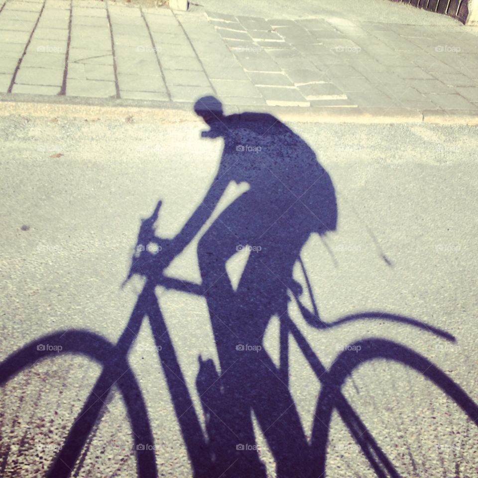 Shadow of bicycle on street