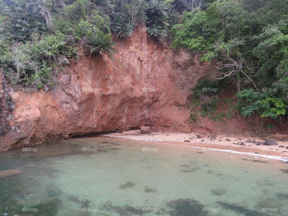 red rock cliff beach