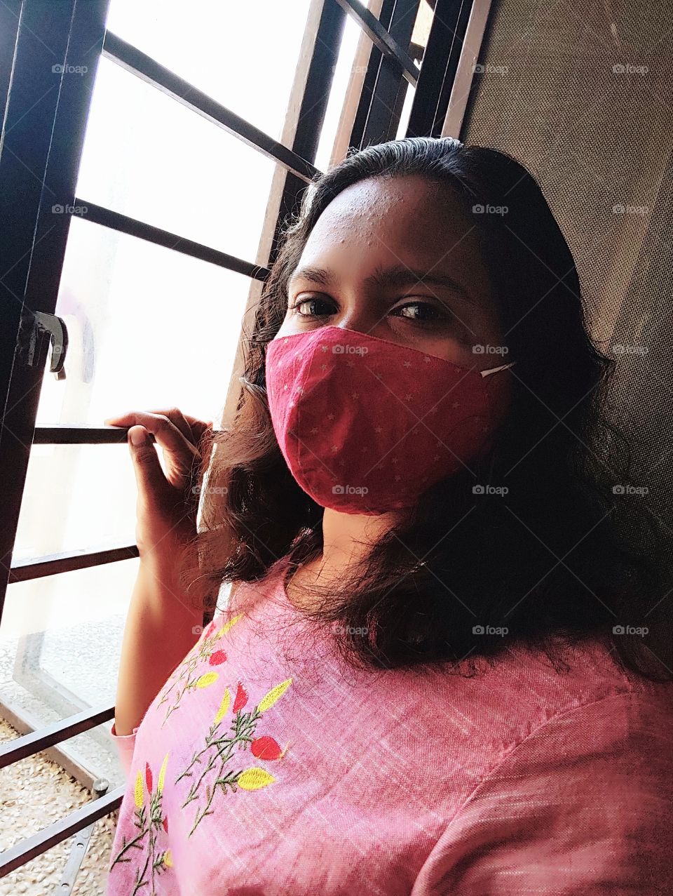 Selfie of a woman wearing mask
