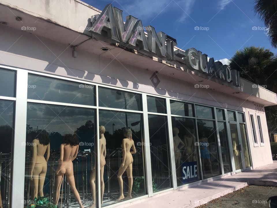 Mannequins in a abandoned store window 