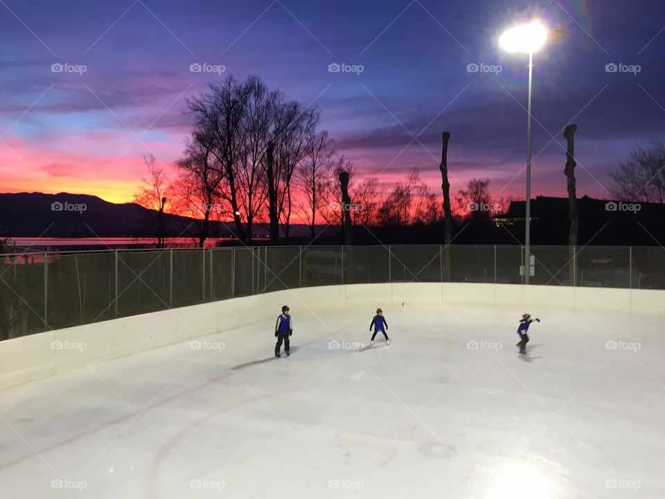 One of the best activities in winter - outdoor ice skating... With a view like this: priceless. Rapperswil with view to Lake Zurich, Switzerland 