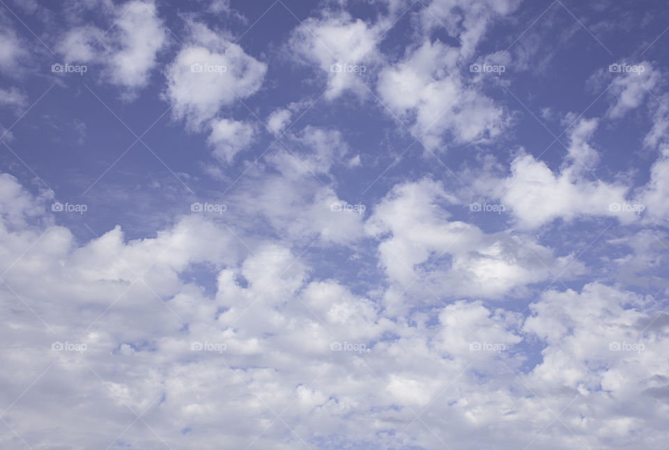 The beauty of the sky with clouds and the sun.