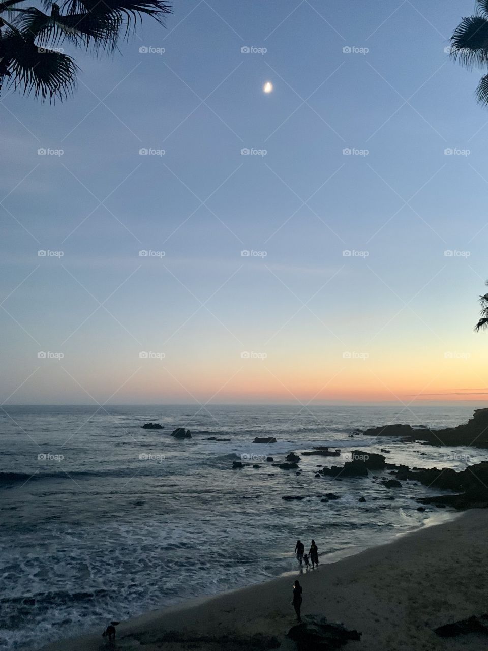 Walking on the beach at sunset 