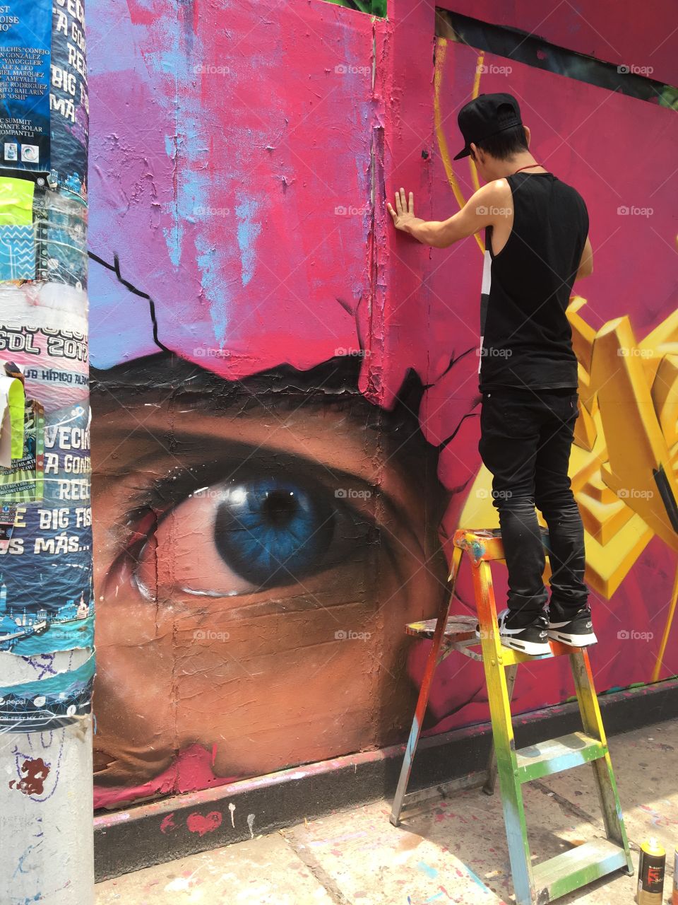 Artist painting a mural 