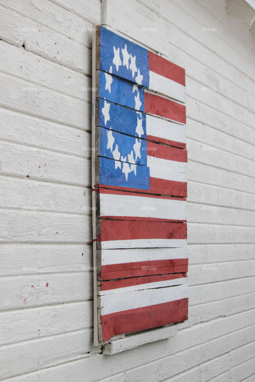 Boards on window painted as American flag