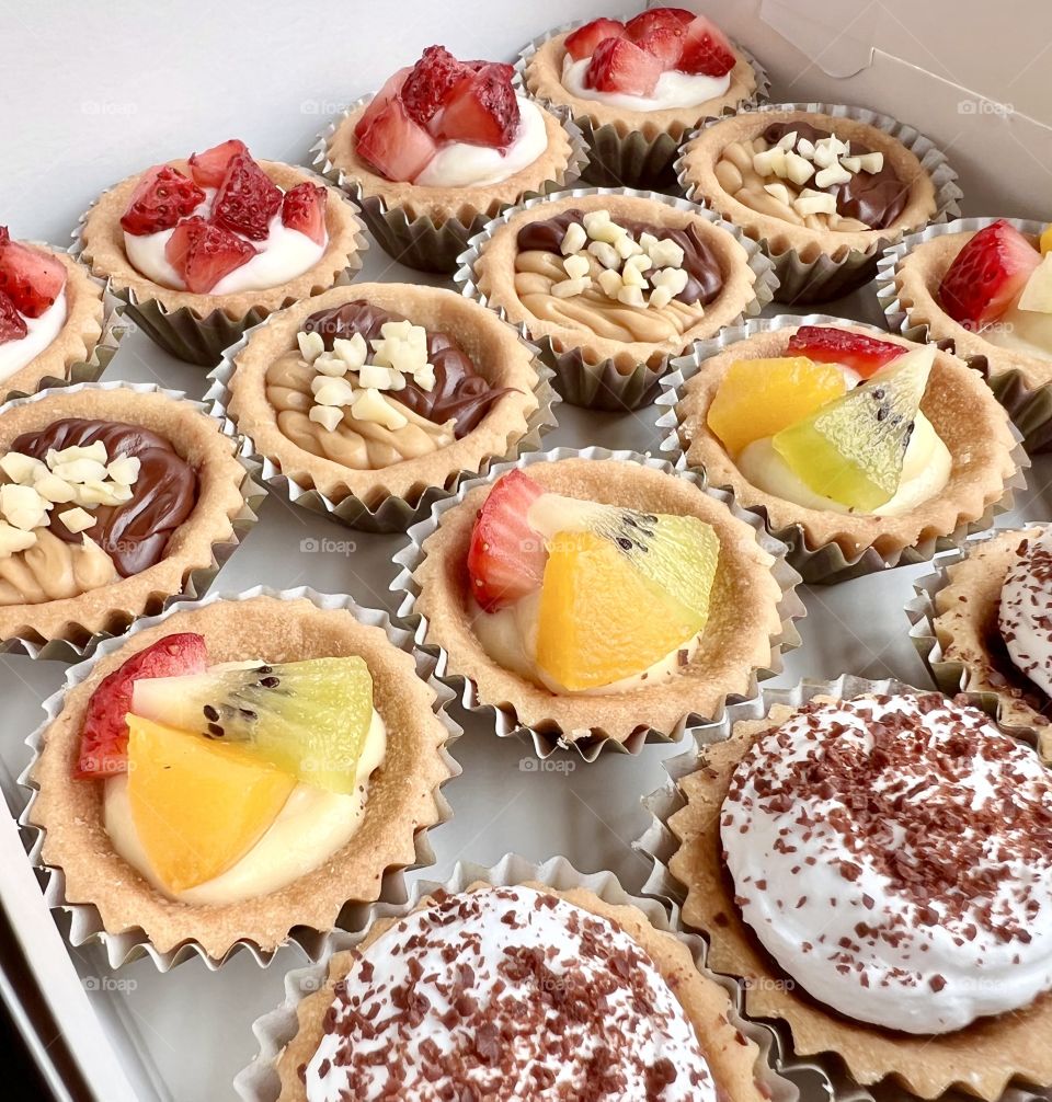 Assorted homebaked Fruit tarts and Nutella chocolate nut butter tarts 