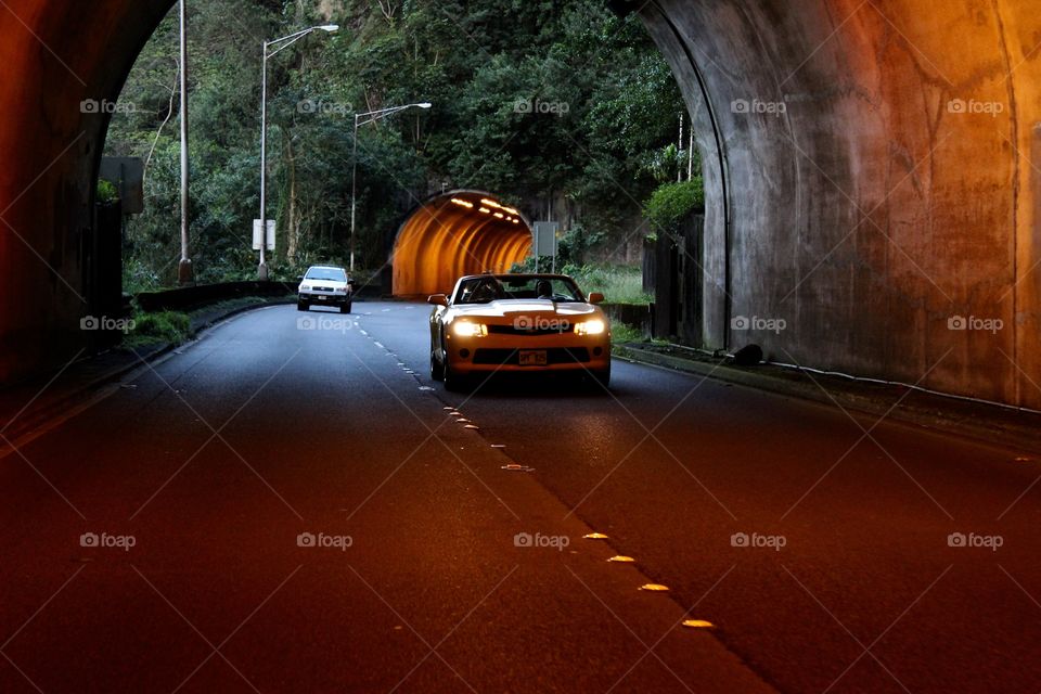 Riding in the back of a truck soaring through tunnels in Kaneohe, HI