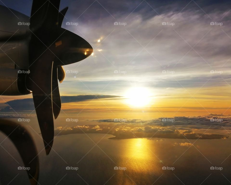 Beautiful sunset view from inside the airplane.