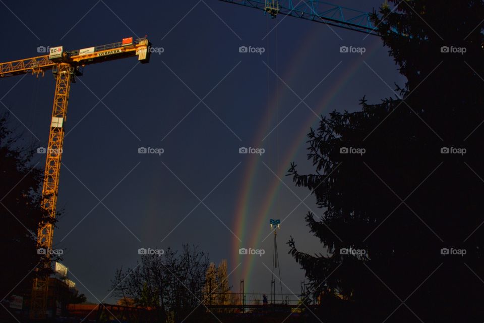 Rainbow in sky during night time