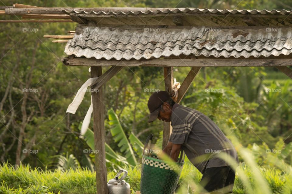 old farmer resting and preparing for breakfast