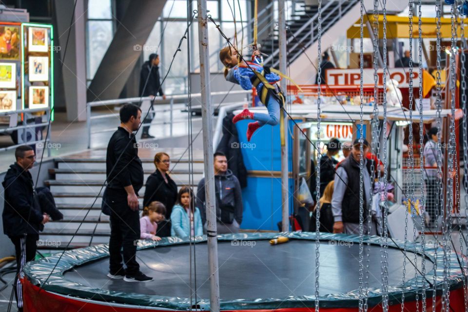 A girl jumping on a trampoline