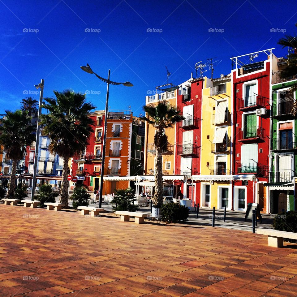 Buildings along the boulevard in Villajoysa, Spain. Boulevard in Villajoysa, Spain. Photo taken during the winter time in December but the weather is really warm.