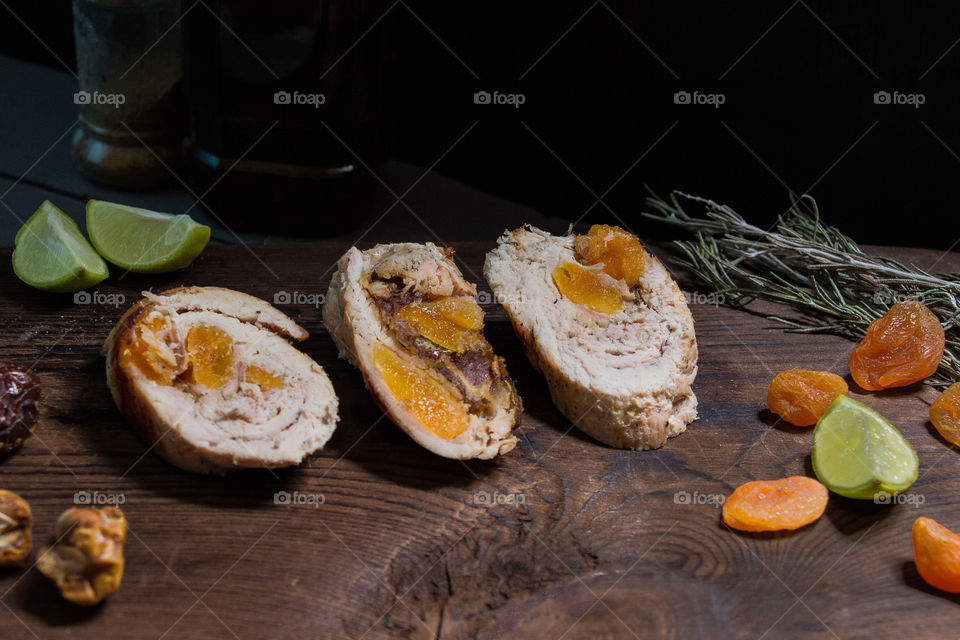 Chicken Ballotine stuffed with dates and dried apricots.