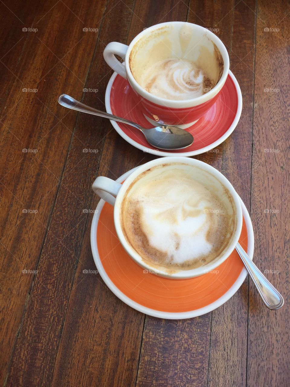 Two Cups of Italian coffee on a wooden table