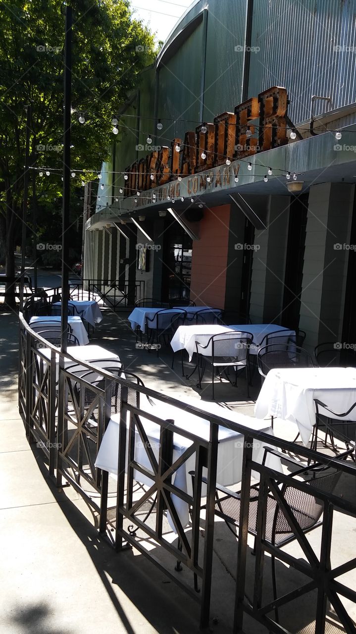 tables and chairs with white cloths