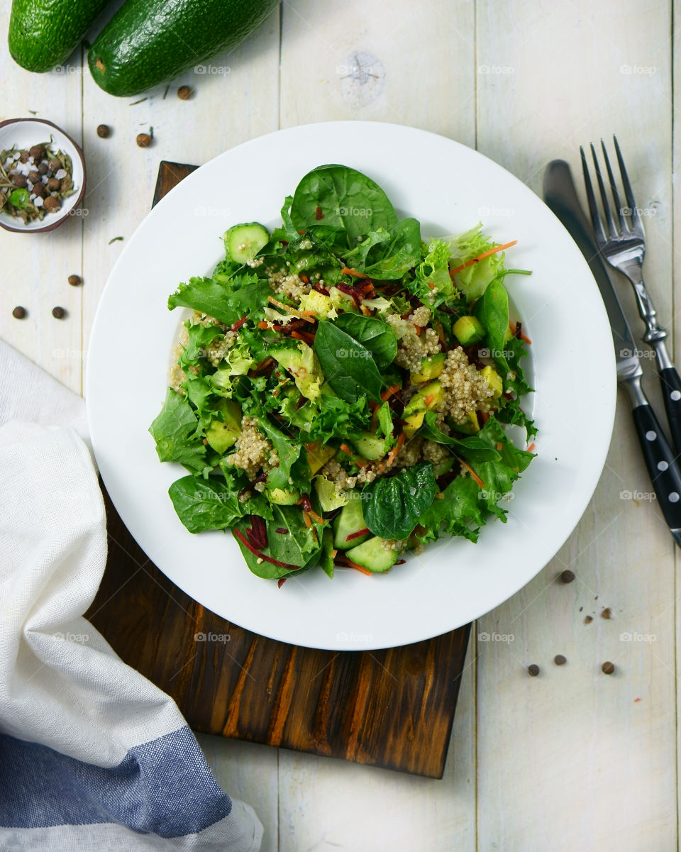 Healthy green salad with quinoa