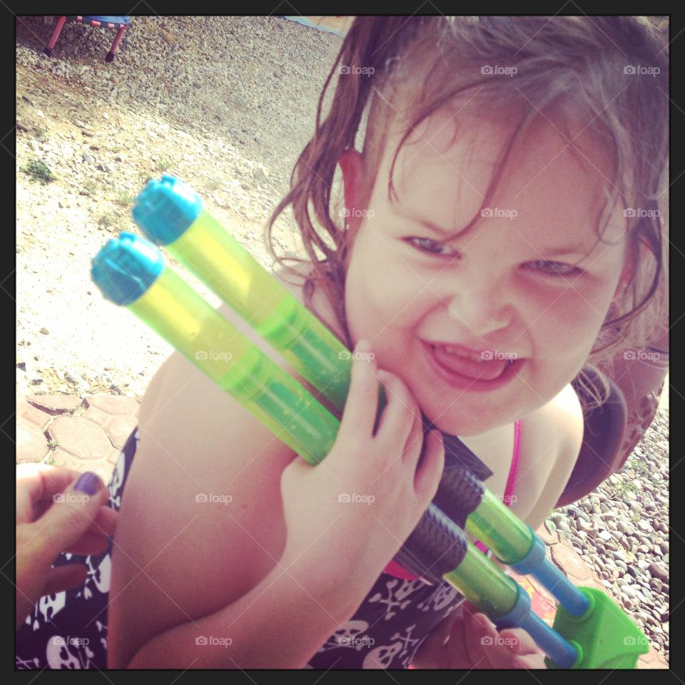 That’s the, “ I just shot Mommy in the face with my water gun!”, smile