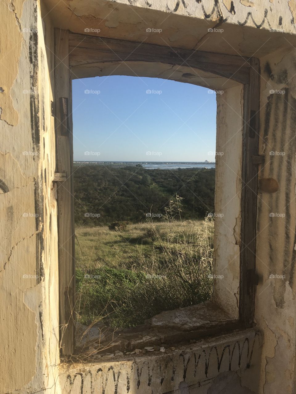 From old farm, window opening on landscape 