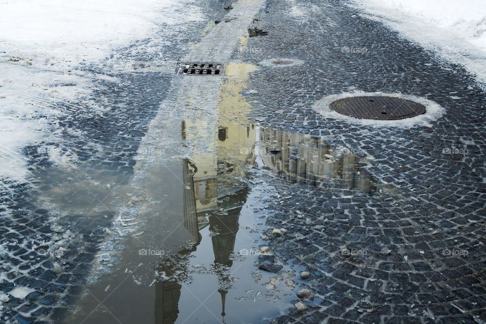 church reflection in puddle