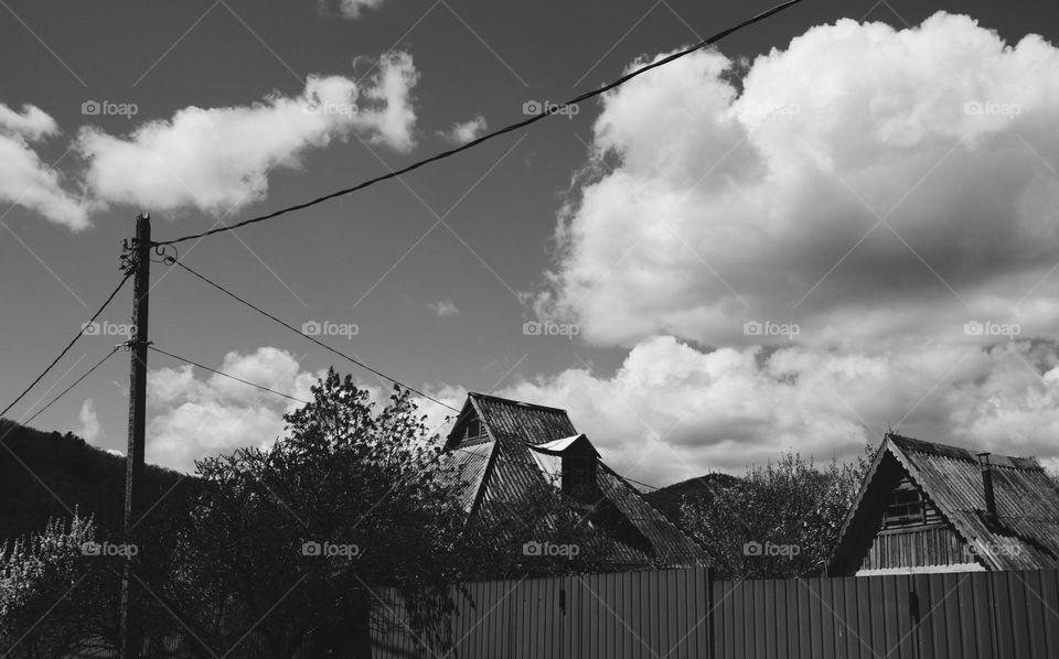 Black and white photo of old houses in a small Russian village