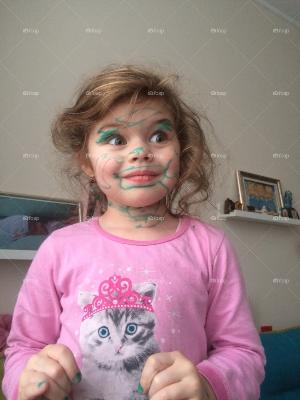 Cute girl with painted face. 