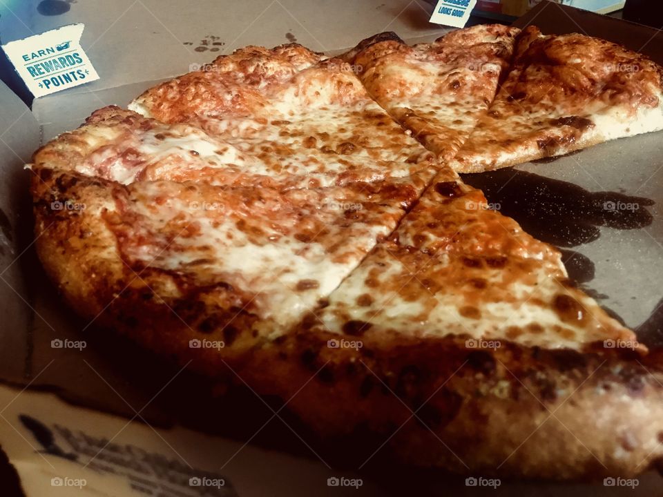 Enjoying a hot and fresh dominos pizza with the family. Cheesy crispy deliciousness