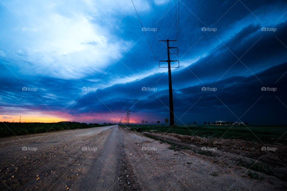 Severe line of storms rolling across open fields 
