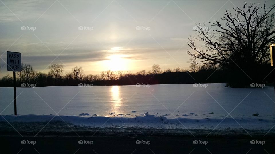 sunset. frozen field
