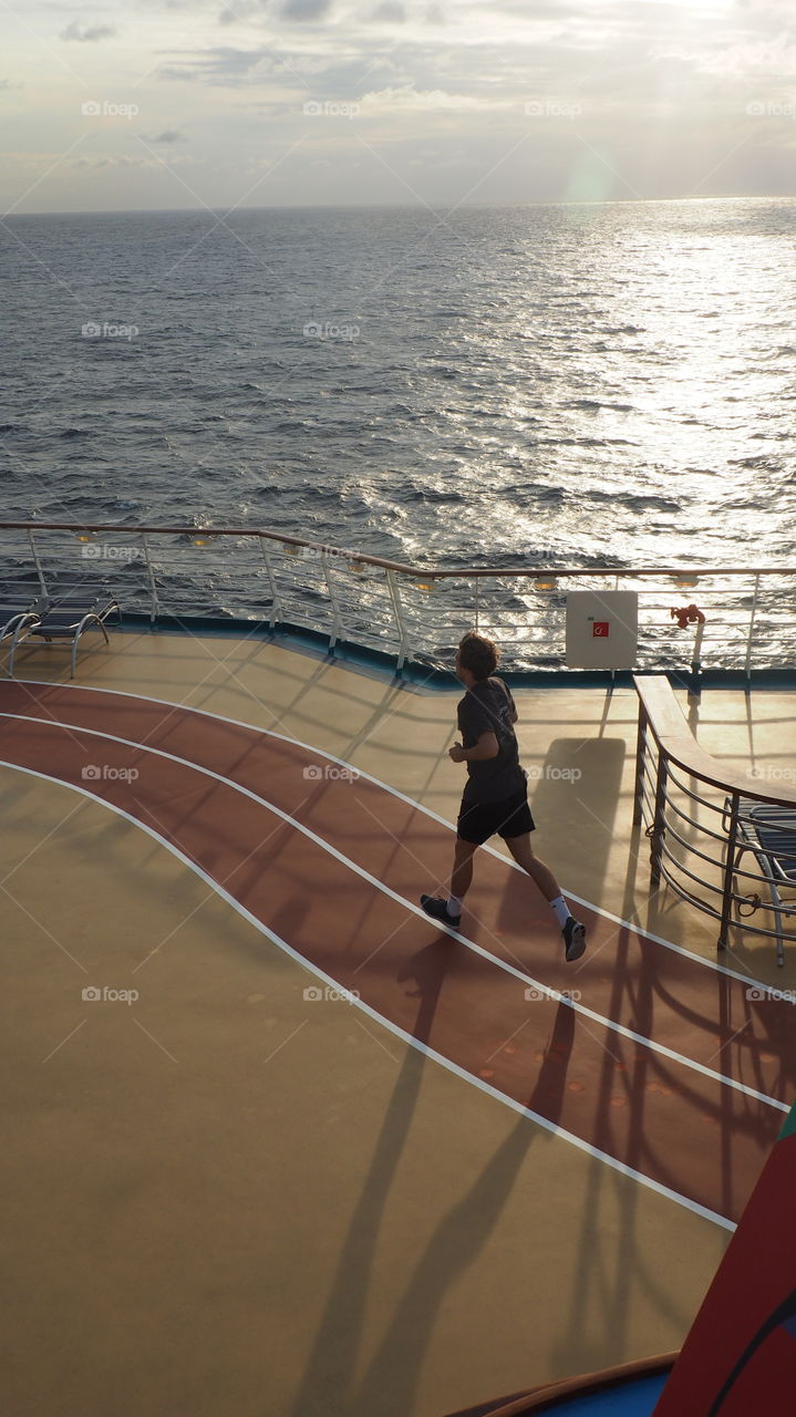 Young man running. Early morning excercise