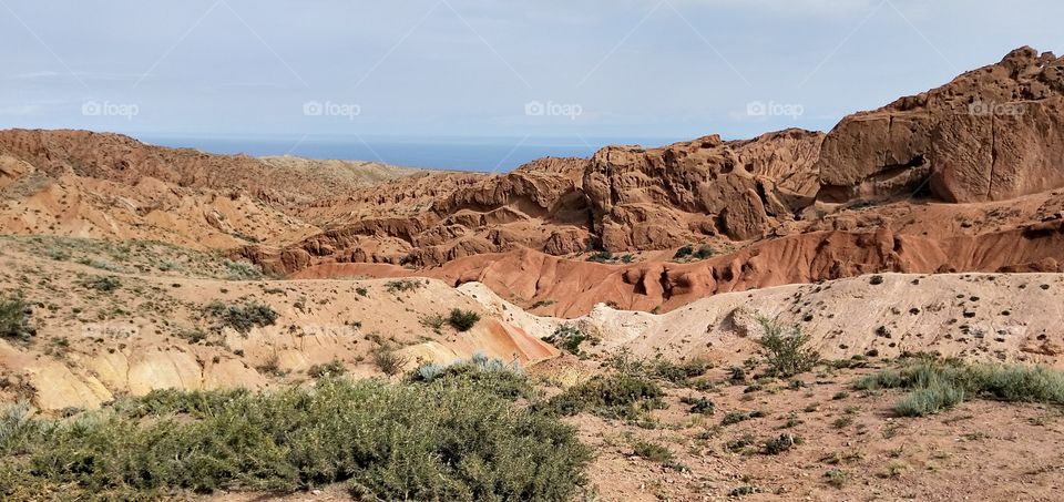 Skazka Canyon is a small gorge on the southern shore of Issyk-Kul, Kyrgyzstan, famous for its red clay rocks.