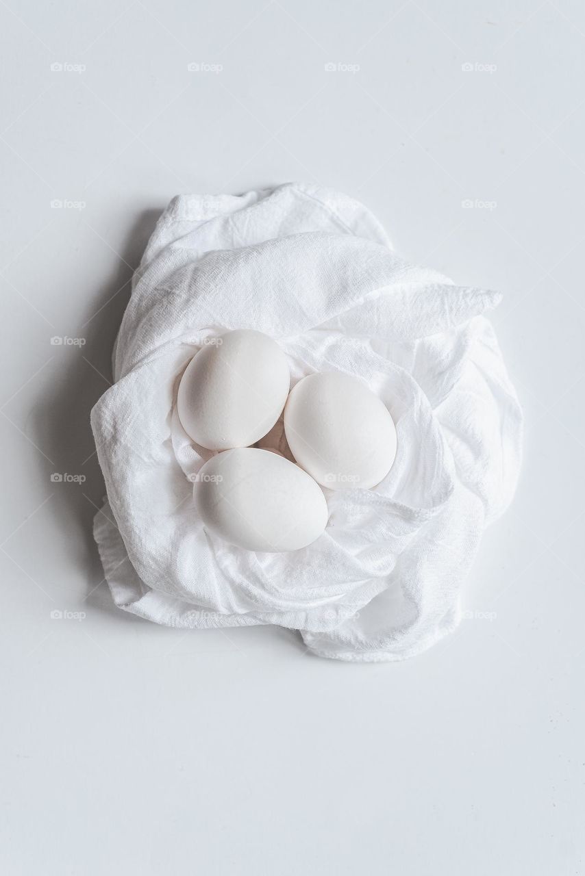 White eggs in white cloth.