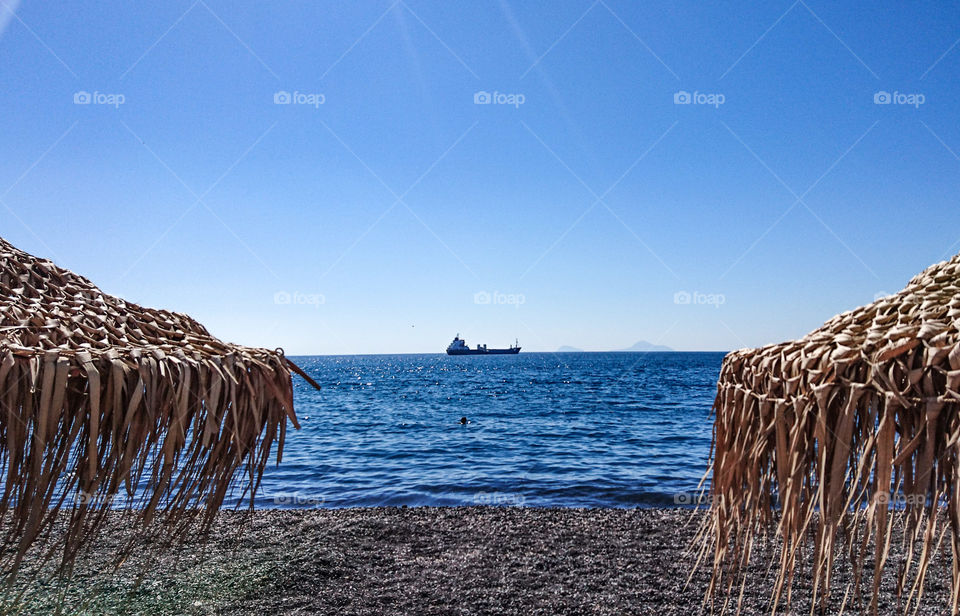 Boat on the blue horizon