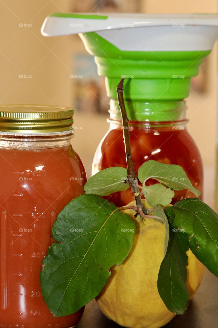 Homemade fruit preserves, quince fruit in canning jars, quince fruit also included 