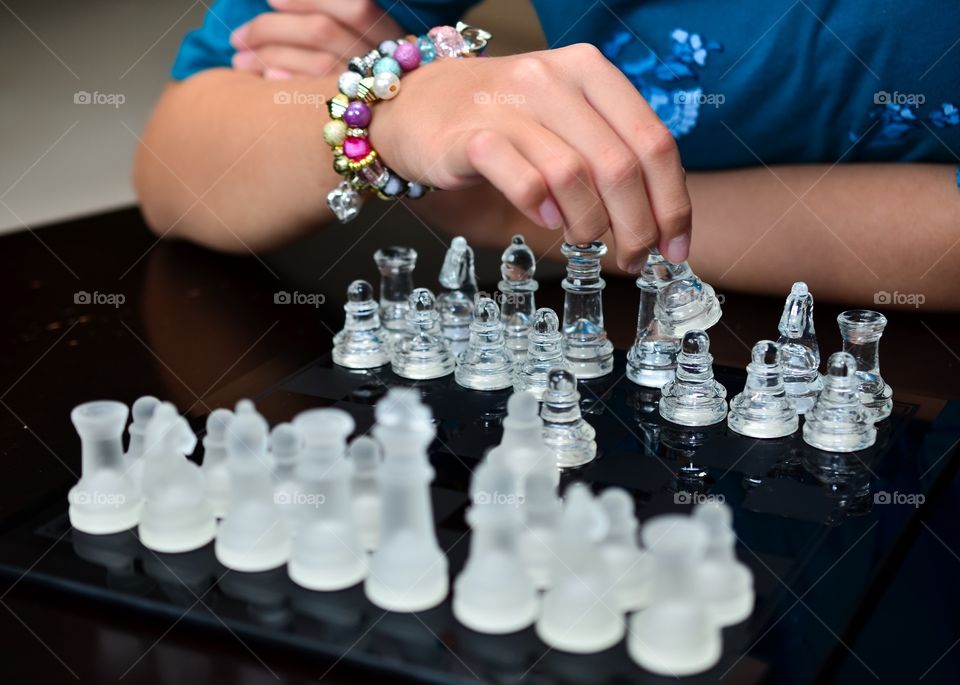 Young female playing chess