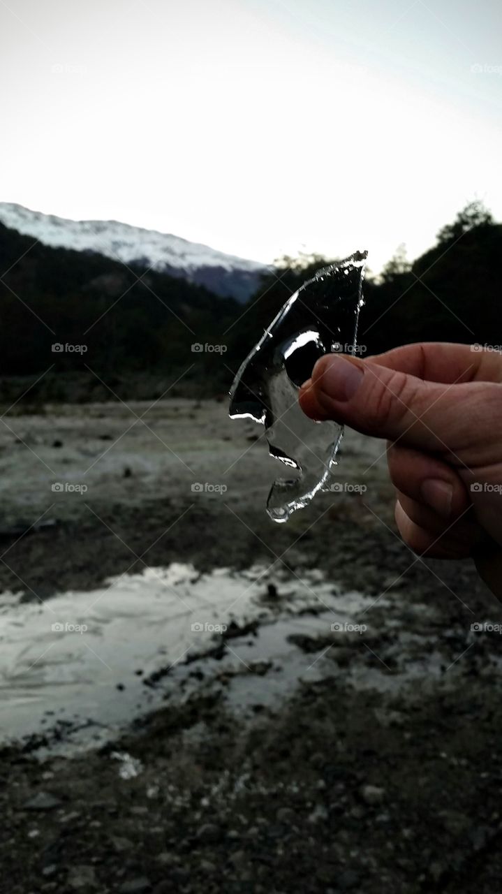 Close-up of a person holding ice