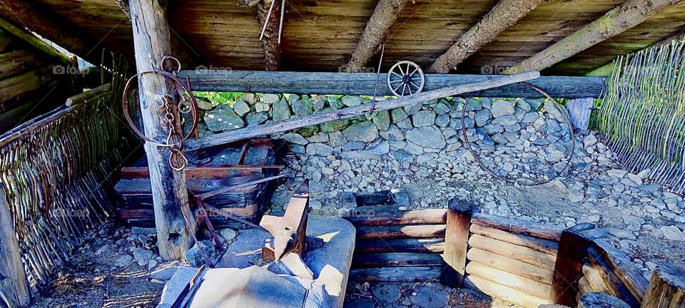 This is the interior of one of the houses in the “Keltendorf Gabreta” near the township of “Ringelai” in “Bavaria”, Germany. The walls are roughly timbered made from stacked stones. 2023. Hypnotic Productions