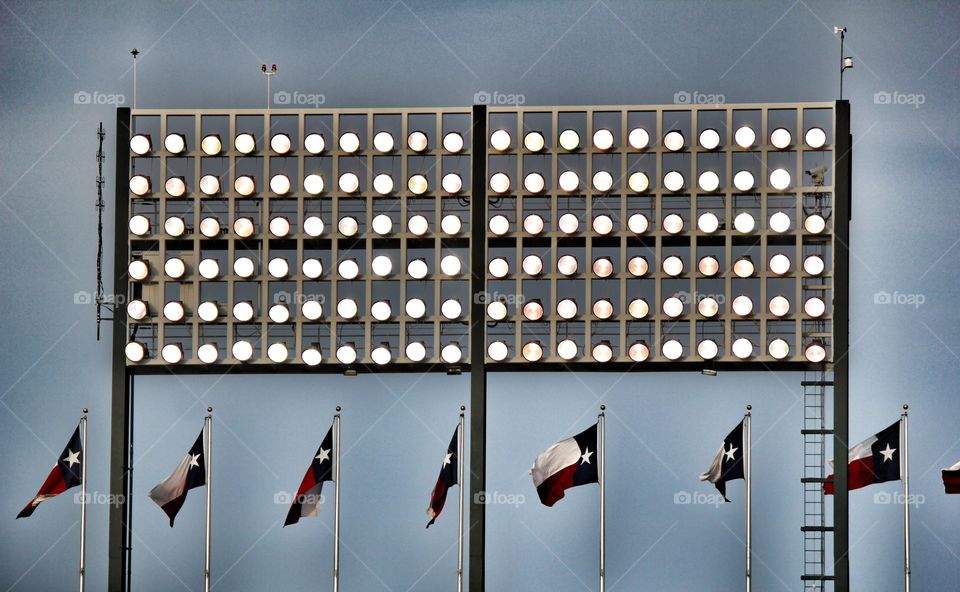 I love Texas. Texas flags under baseball field lights at globe life park in Arlington Texas
