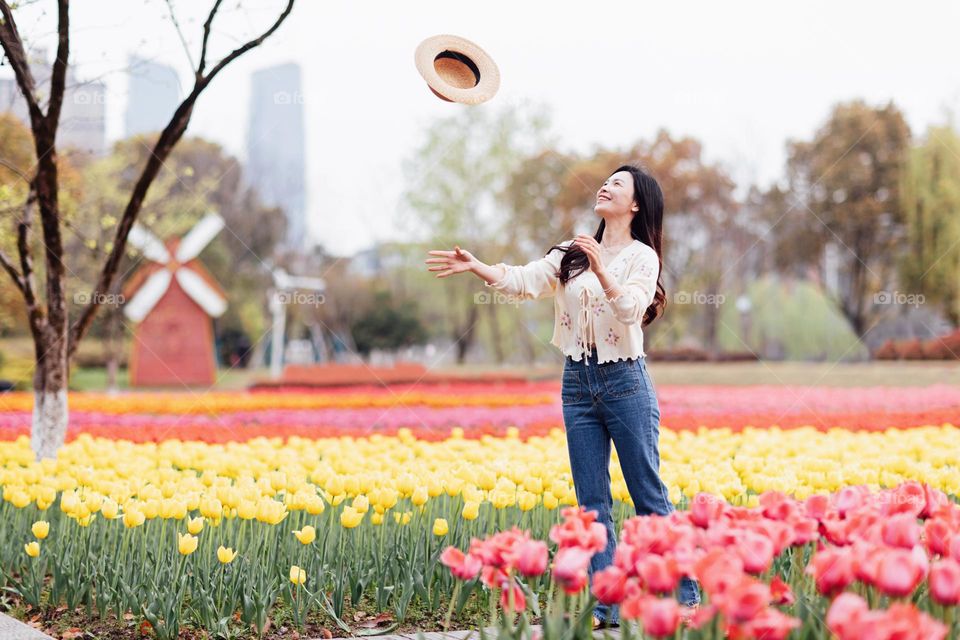 Lifestyle portrait of happy Asian woman at spring 