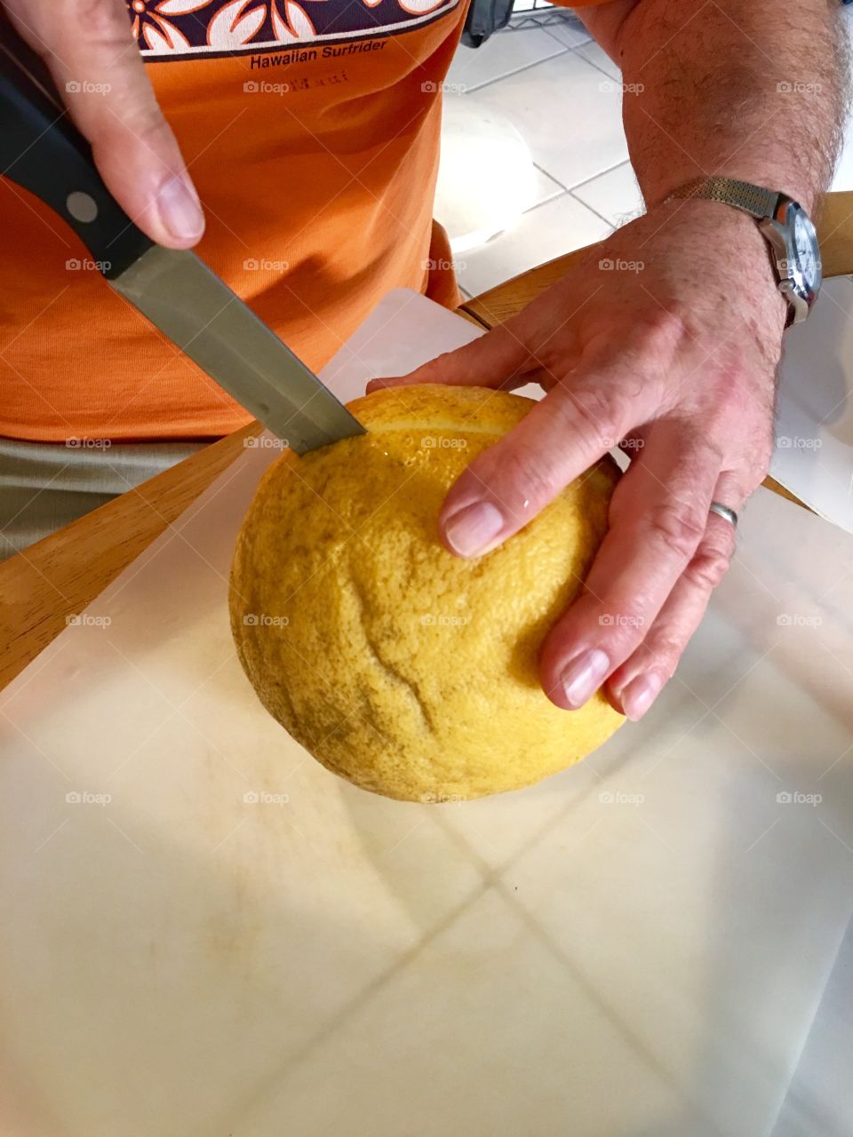 Cutting a giant lemon.