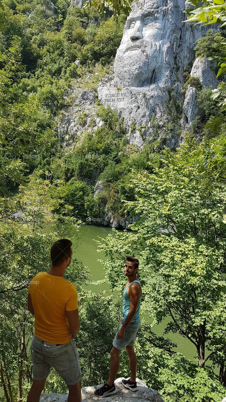 2 brothers and the face of Decebalus, the king of Dacia, Romania