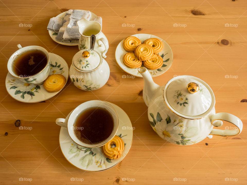 High angle view of teapot and tea cup