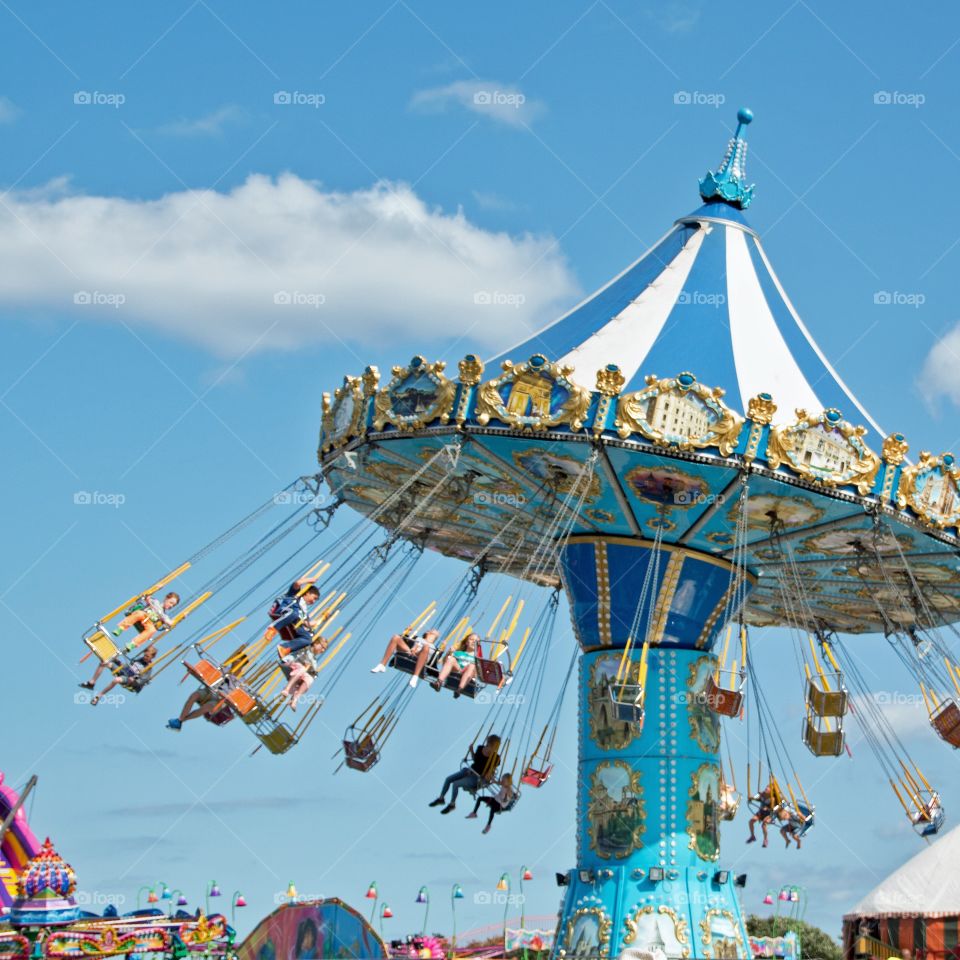 Kids enjoying ride in carnival