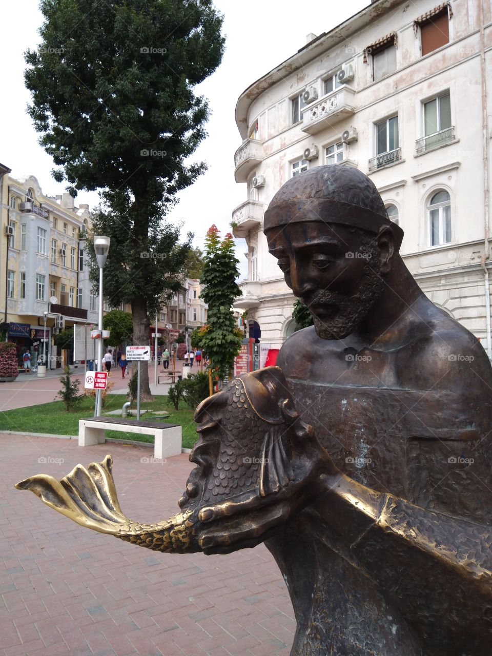 The fishman and the golden fish statue in Varna, Bulgaria