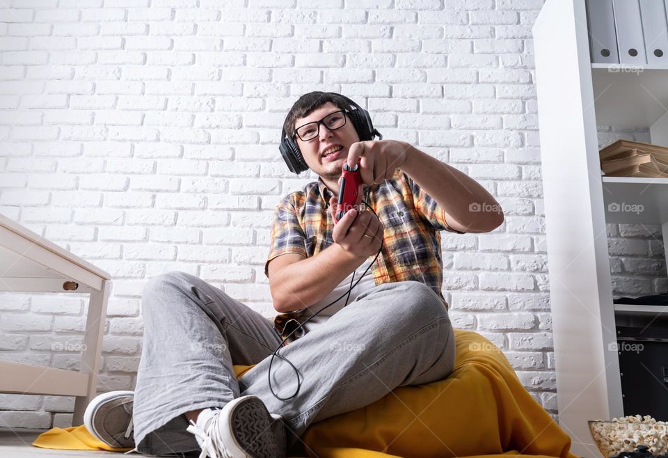 young emotional man playing video games