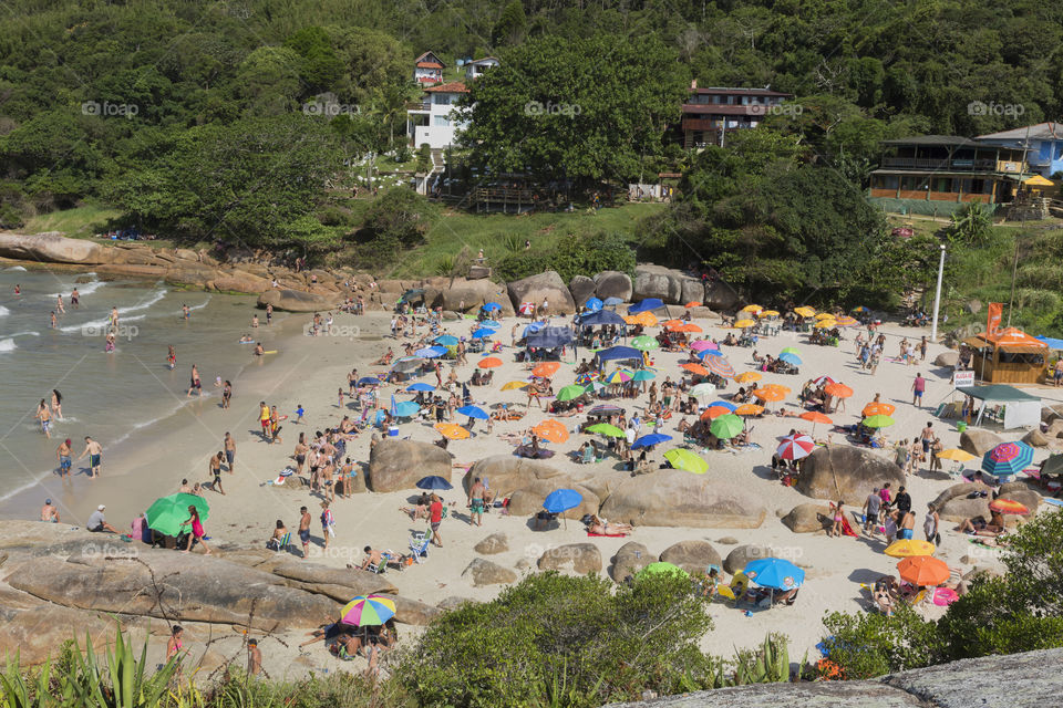 Tourists enjoy the summer on the little beach in Barra da Lagoa in Florianopolis Santa Catarina Brazil.