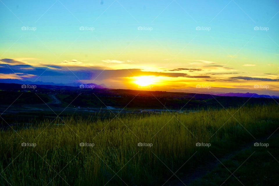 SUNSET OVER MEADOW