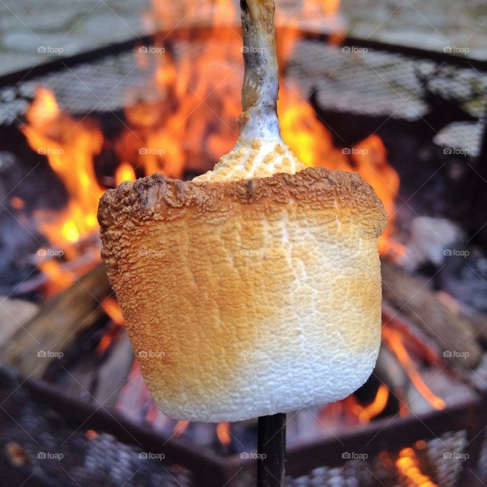 Marshmallows roasting over bonfire