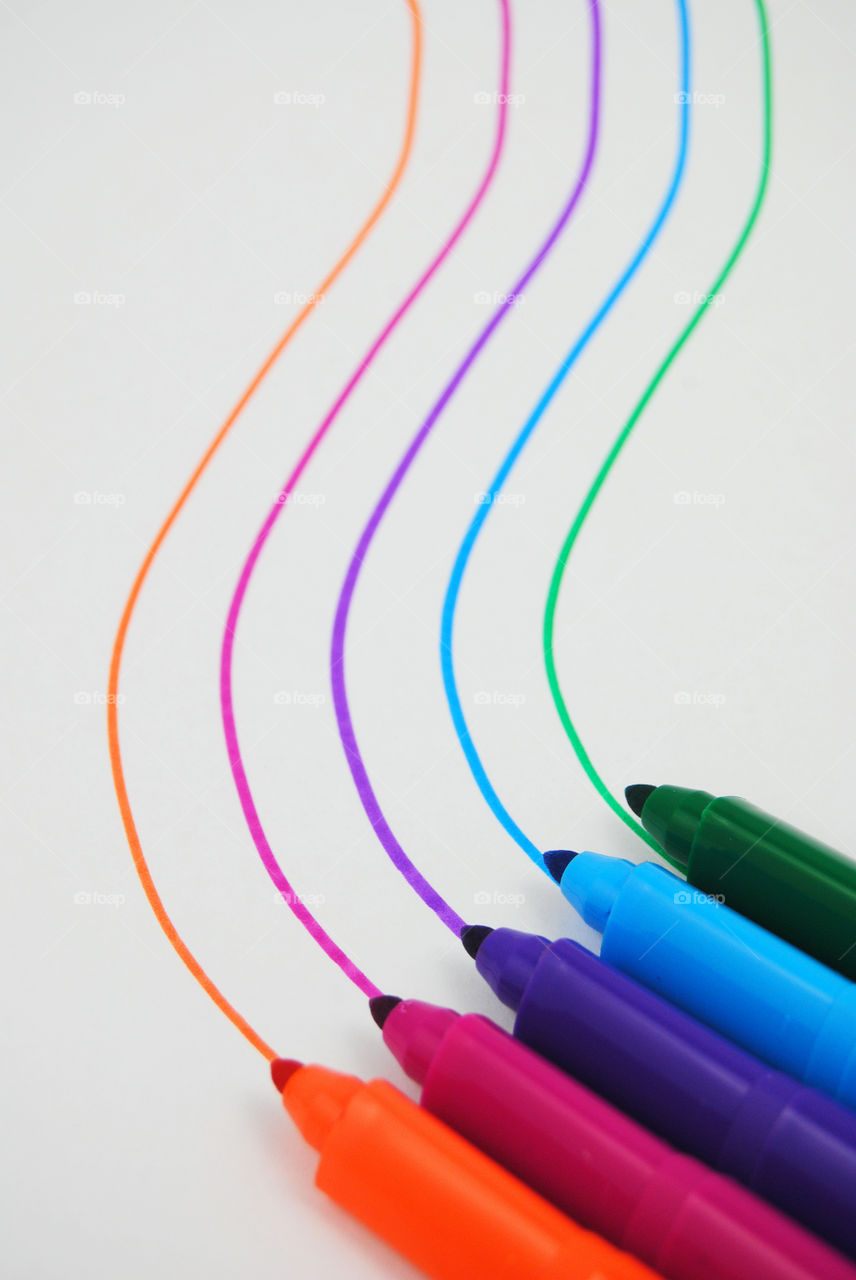 High angle view of felt tip pen with curved stripes